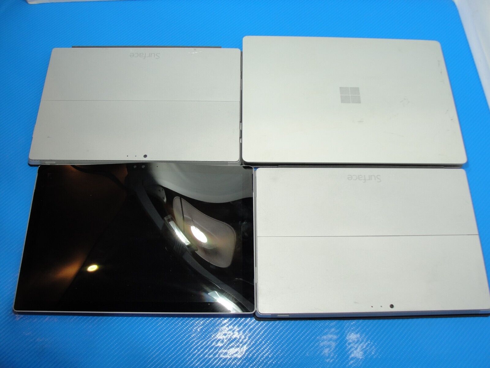 Mixed lot bundle of Surface devices, Pro 3/4/laptop, AS IS for parts or repair